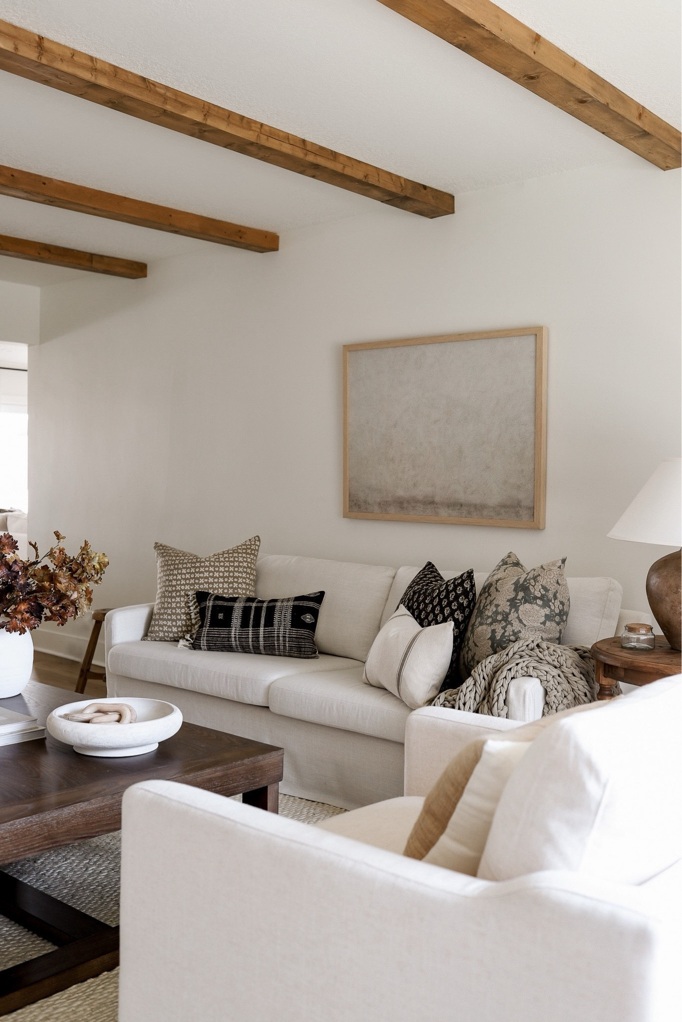 Shop our living room furniture and decor, including this slipcover sofa and jute rug!! 

#couch #art #homedecor #coffeetable #pillow 

#LTKhome #LTKsalealert #LTKfindsunder100