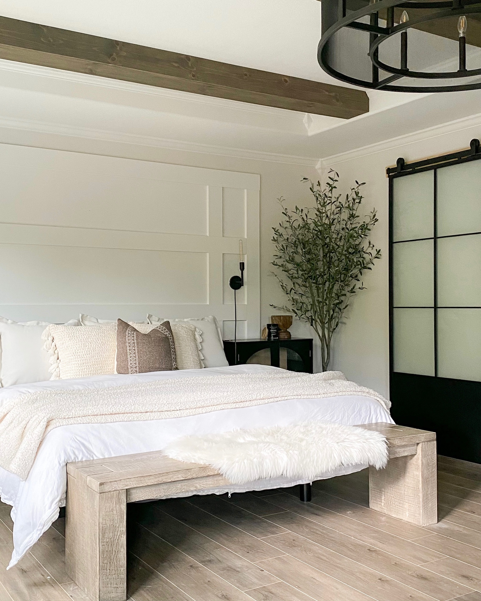 Master bedroom decor. Affordable bedding. White duvet cover. 

Master bedroom decor. Olive tree. White bedding. Metal barn door. Wooden bench. Fur rug. Black cabinet. Plug in sconces.

#LTKhome #LTKsalealert