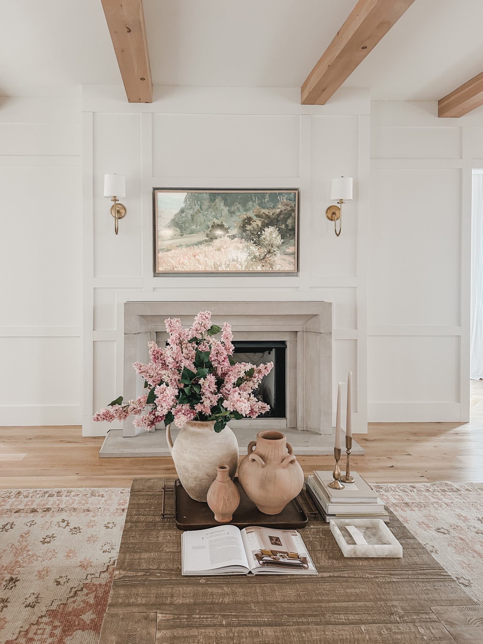 Spring living room coffee table details! These faux lilac stems add the perfect pop of pink for a spring transition 

Spring living room, coffee table details, wooden furniture, faux stems, vase finds, candle holder, gold detail, wall sconce, tv frame art, decor book, spring frame tv art, neutral area rug, creamy whites, pops of pink, natural wood tone, living room detail, light and bright, home aesthetic, spring style, furniture faves, neutral home, Pottery Barn style, found it on Amazon, Samsung The Frame TV, shop the look!

#LTKhome #LTKSeasonal #LTKstyletip