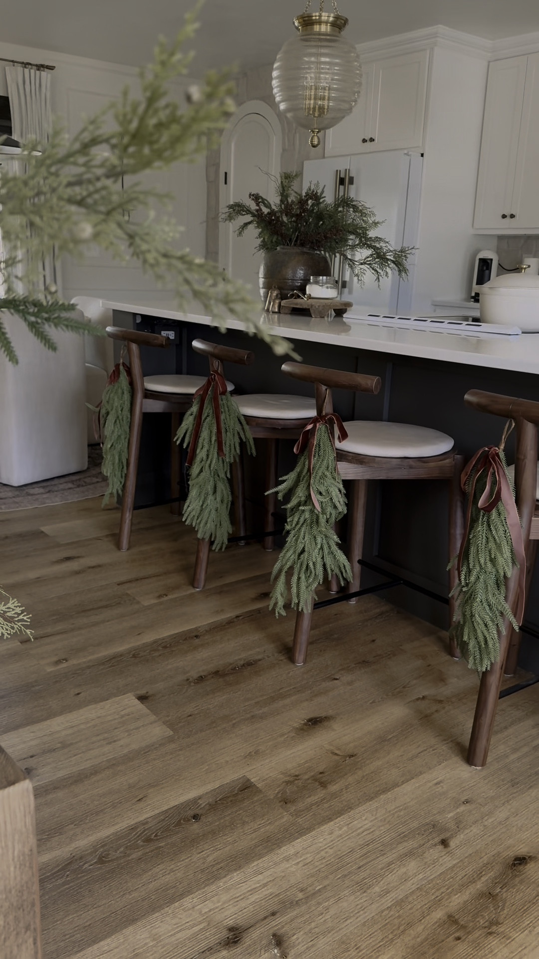 An easy way to add holiday charm to your dining chairs or counter and bar stools! I used floral wire to attach! Use code KE15 to save on my light fixtures from lightopia until 11/20! And code KRISTINAEVANS10 on Ruggable! KE15 at rugs direct! 

#LTKHome #LTKHoliday #LTKWatchNow