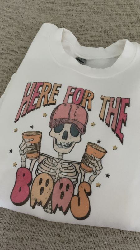 Here for the boos! Who else loves spooky season and seasonal shirts?! They are such a fun way to be festive - like this Halloween one! 

Halloween graphic tee, Halloween sweatshirt, skeleton shirt, here for the boos, funny Halloween shirt, sweatshirt, Halloween, women’s clothes

#LTKSeasonal #LTKfamily #LTKFind