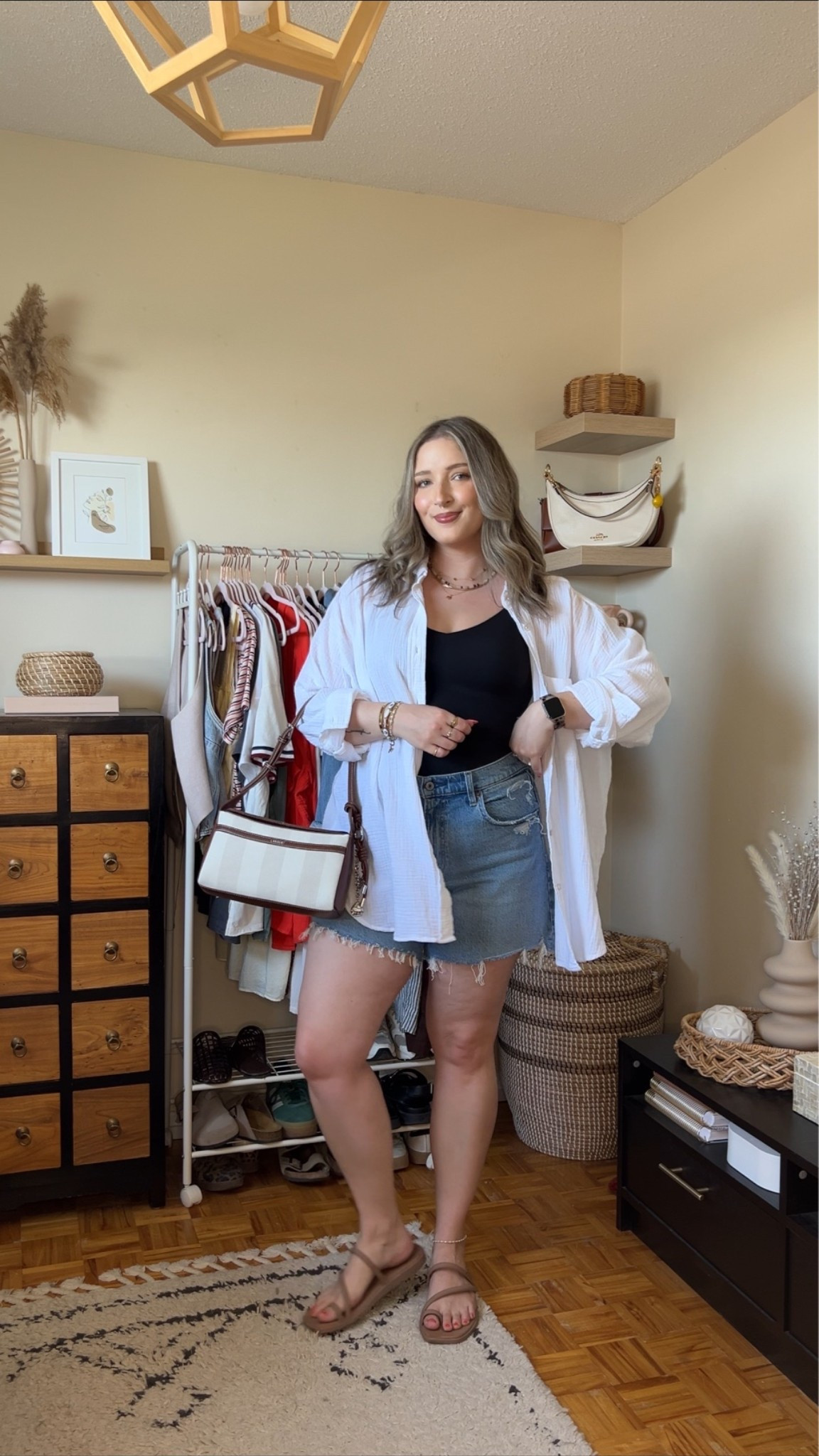 Go to summer outfit formula! Wearing M in the black tank (has a built in bra!) and L in the white button up shirt. Sized up to 32 in the denim shorts for a comfy fit. Crocs sandals are super comfortable, I’m a 9.5-10 and wear a 10. Canadian crocs link under “similar products”. Bag is Lambert

#LTKsummer #LTKmidsize #LTKstyletip