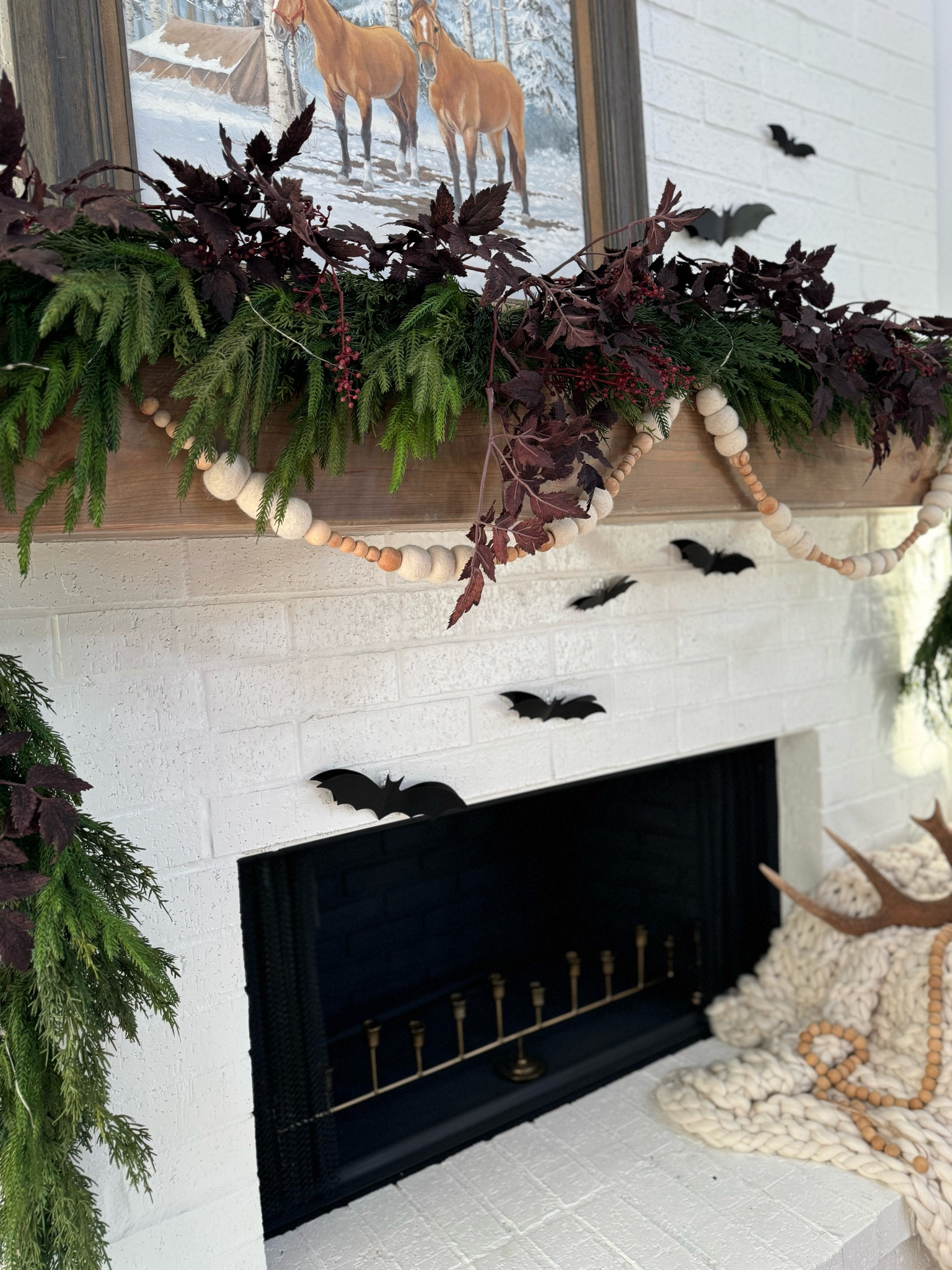 🖤 Spooky meets cozy! 🦇🎃 This fall fireplace setup combines Halloween charm with warm, cozy vibes. Loving the bat decor and natural greenery for a perfect seasonal touch! 

I’ve used this greenery year round and just change out the florals or leaf colors to match the season or holiday!! 🍂. I love the greens with the deep purples.   #HalloweenDecor #CozyFallVibes #FireplaceDecor #FallHomeDecor

#LTKSeasonal #LTKHome #LTKFindsUnder50