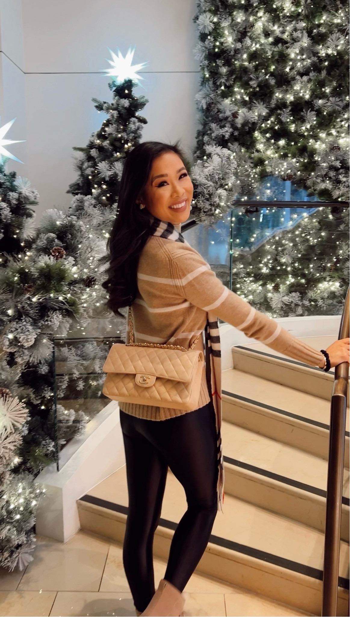 New York outfit with striped cashmere sweater paired with the best faux leather leggings and Sorel boots that I love! 

#LTKSeasonal #LTKstyletip