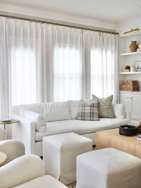 My living room furniture is a mix including the West Elm Marin Sofa, Target cube ottomans, CB2 Boucle chairs. 
The pillows are from McGee and Co and of course completed with the famous Amazon pinch pleated drapes 

#LTKhome #LTKstyletip #LTKFind