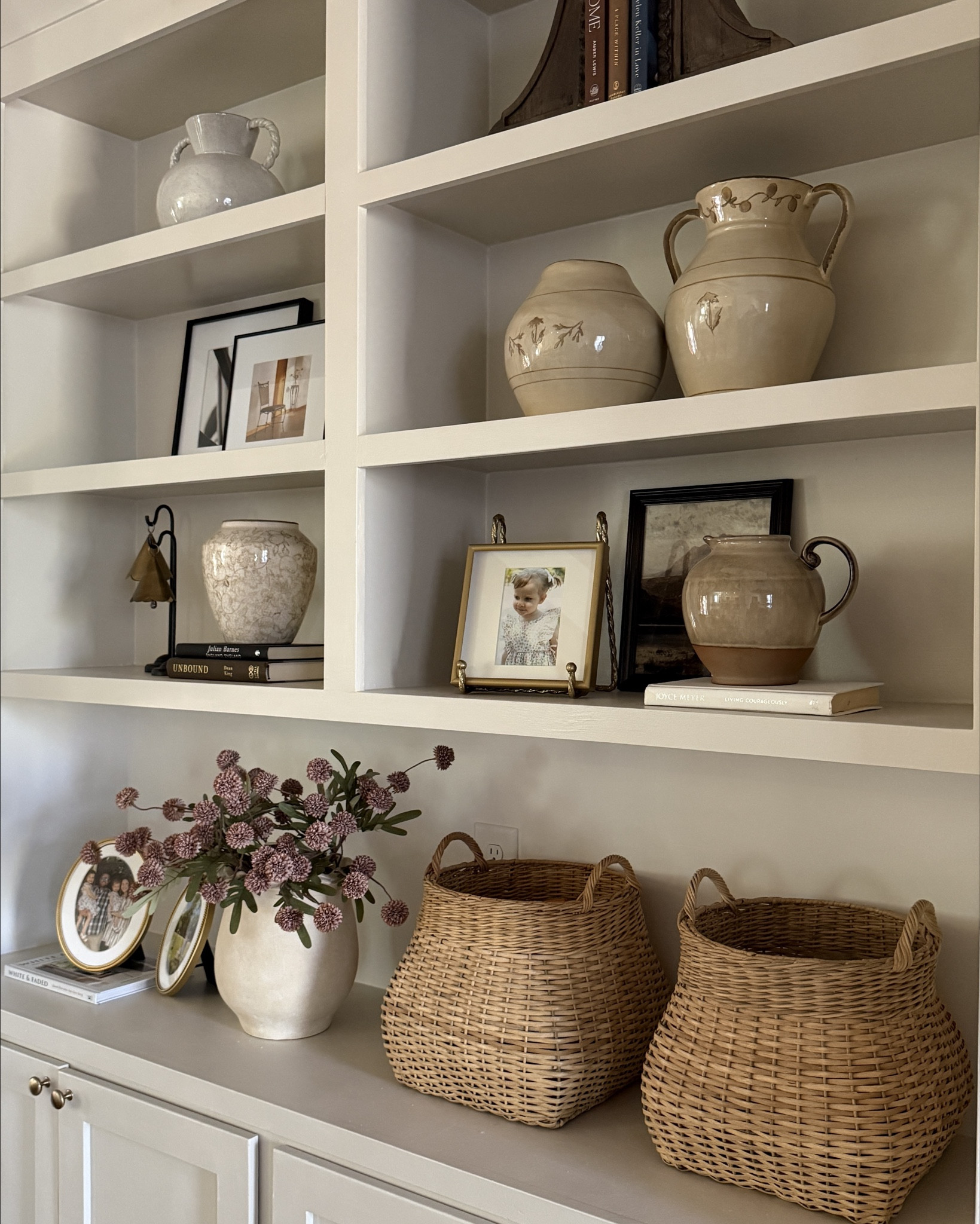 Can’t wait to fill those frames with pictures as a family of 5 in just a few more weeks! 🤍 Part of nesting has definitely been resetting the house before baby sister arrives and making things a little easier for routines! I’m loving these florals and patterns on our styled bookshelves! 

#LTKmomlife #LTKHome #LTKFindsUnder100