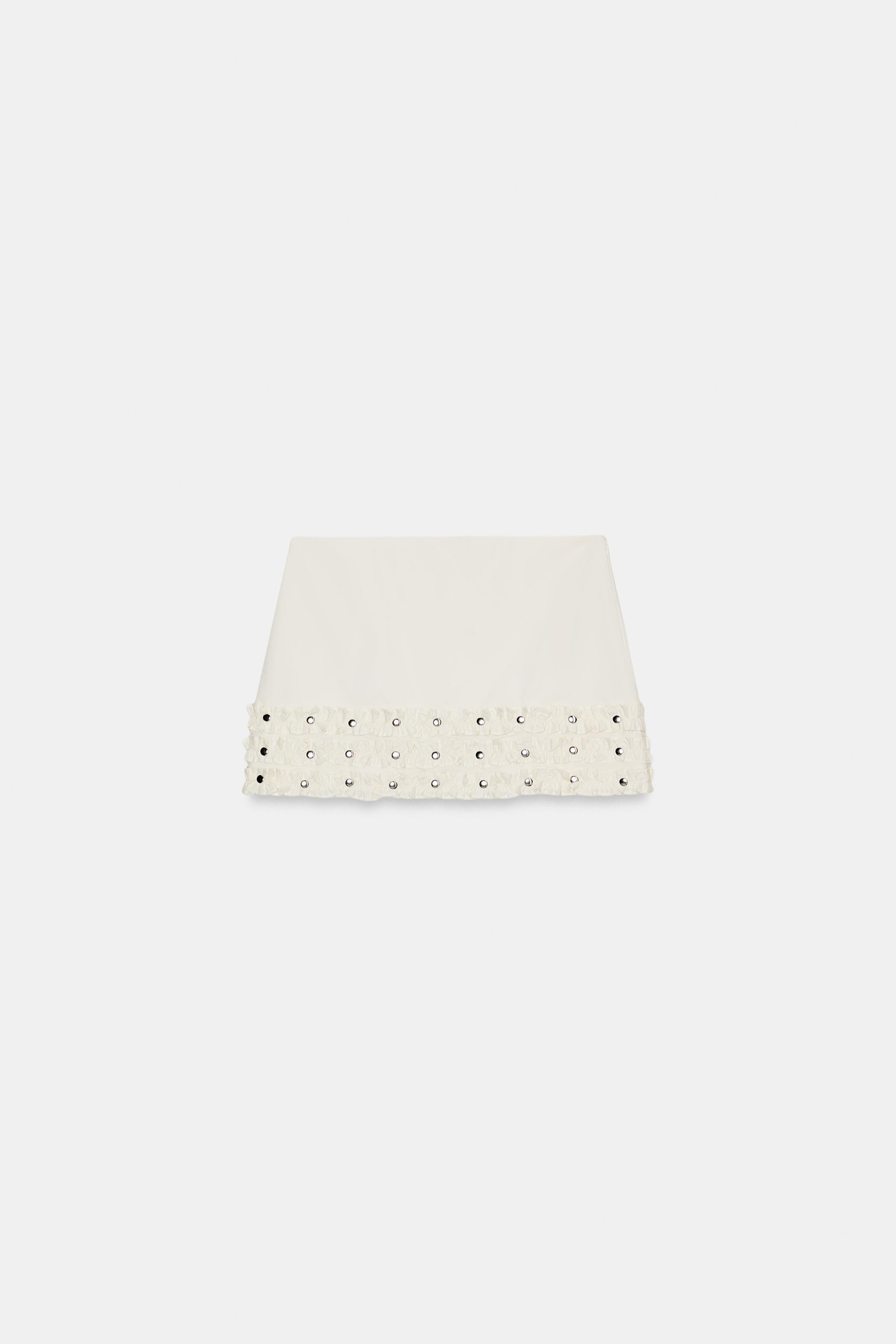 Mid-waist skirt with ruffles and stud details. Featuring a matching inner lining and invisible si... | Zara DE