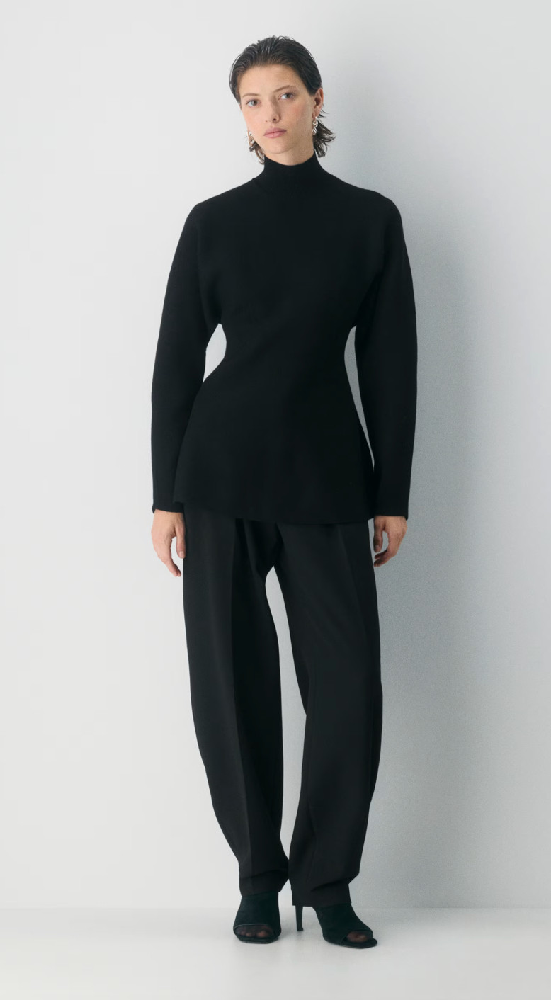 Bold yet timeless 🖤 this black turtleneck makes a statement with its sleek, elevated fit. Perfect for a night out or a polished daytime look. #BlackTurtleneck #LTKStyle #ChicEssentials #ElevatedBasics 

 