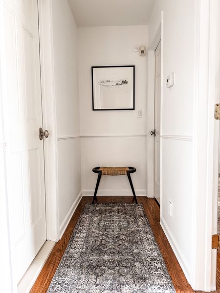 Hallway progress. Love the neutral runner, which is the perfect color scheme I was looking for and is now on sale. I styled it with a large frame and a woven wooden stool. 

#LTKhome #LTKFind #LTKfamily