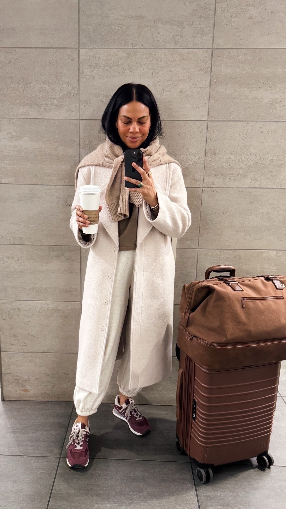Travel outfit: When in doubt, a long coat and draped sweater makes everything look chic- even sweats! Love these sweatpants by Varley - SUPER soft, cropped and comfy in two lengths. I got the shorter. I’m 5’4”. Wearing my quince wool coat and affordable cashmere sweater :) size up in the coat.



#LTKTravel #LTKdayinmylife #LTKootd