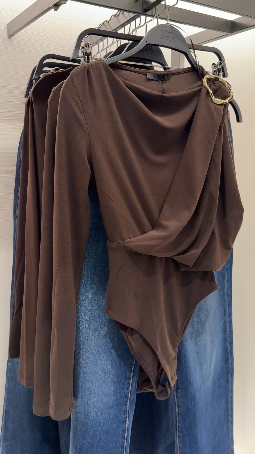 Flowy bodysuit with gold brooch! 

#LTKFindsUnder100 #LTKStyleTip