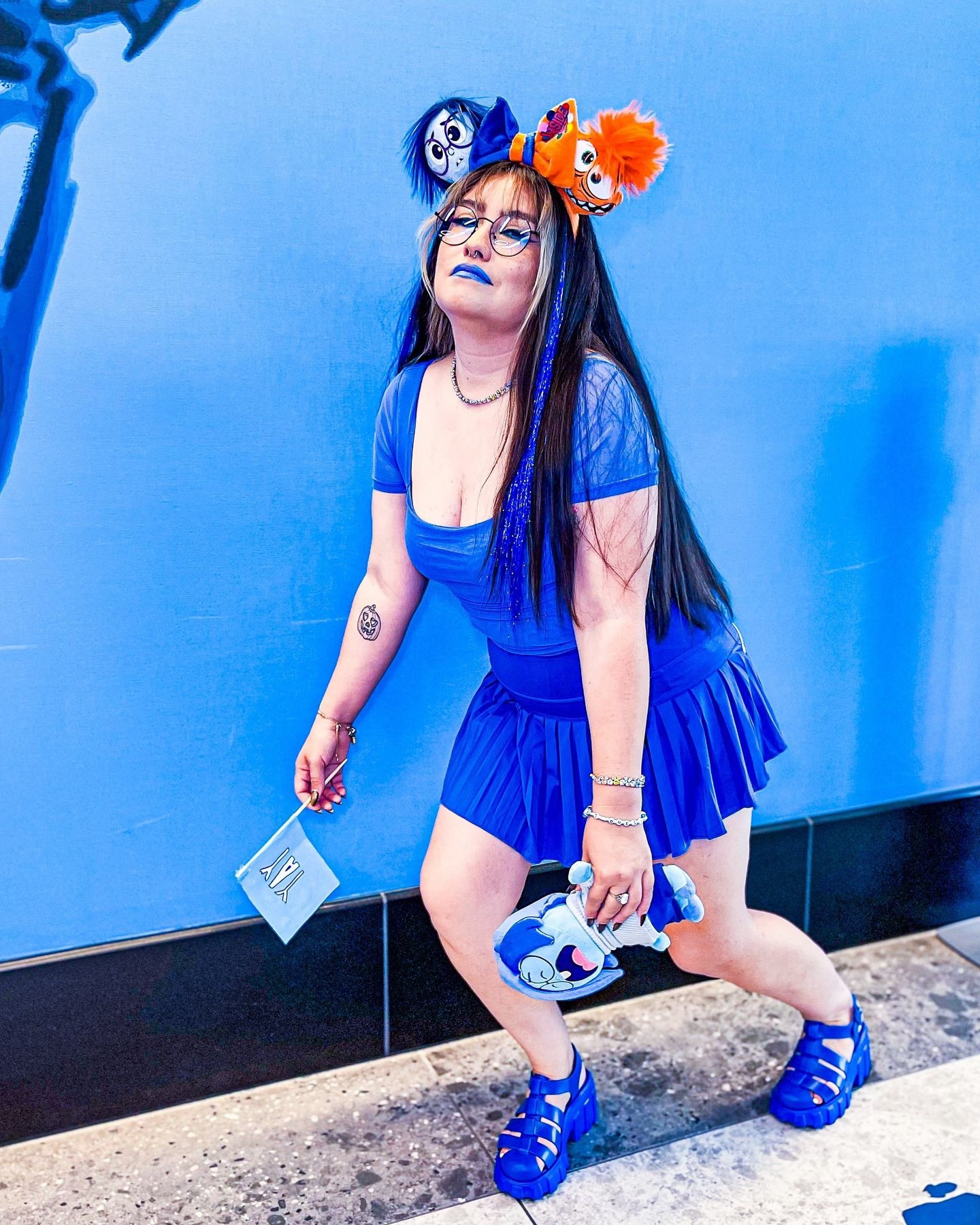 Hi, I’m Sadness. I’m too SAD to walk. Sorry I went Sad again didn’t I? Remember that funny movie where the dog dies.💙🩵😭🥺😢😪😓🙁☹️ Some of my favorite SADNESS from INSIDE OUT quotes.
I always wanted to bound as Sadness, I had actually started planning this bound when our friend @magicallysarita asked us, I was so happy to! Glad I got to be a part of it with my boys meeting Bing Bong at the Pixar Hotel which I had been on my list of things to do! These are the moments I love the Disney community even more.🥰🫶🏻
..🔷🔹Outfit Deets 🔹🔷
.. 🔹Ears from @my_charm_ears_boutique 
.. Ty again for these custom amazing quality ears! Make sure to check her shop out!
.. 🔹Shoes from @melissaofficial use code (Ghoulishglimmer) 20%off 
..
.. 🔹The YAY flag meant a lot to me because Alijah made it for me last minute that morning. I didn’t realize how important and cute it was going to be as part of my bound, especially because he made it real quick with a piece of paper, posing markers, and a chopstick.🥹
..
.. Thank you @magicallysarita for the bag candy and taking most my pics, @alana_inwonderland for the purse, and @johmajesty for letting me borrow the ball core memory purse for the pic!
..
..
..
#insideout2 #insideout #sadnessbound #sadnesscosplay #insideoutcosplay #pixar #pixarmovies #pixarhotel #bingbong #bingbongmeetandgreet #thedisneybound #disneybound #disneyland #disneygirl #disneyadult #disneyfashion #disneystyle #melissasquad #melissashoes