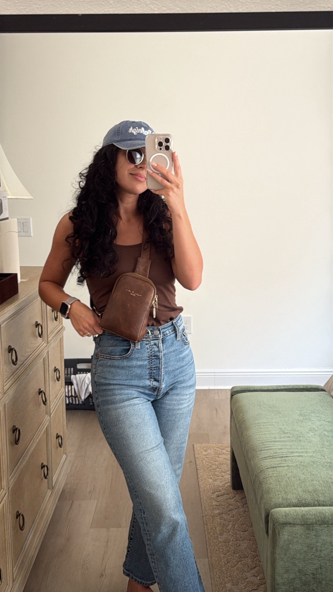 Cute casual jeans outfit for running errands or going shopping! These are the comfiest button fly Levi jeans you will ever wear (they’re also featured in Emily in Paris!)

This little crossbody bag from Amazon is the perfect size to hold your phone, small wallet, sunglasses, & lip gloss. These aviators are also from Amazon and fit so perfectly under a baseball hat! 

#LTKFindsUnder50 #LTKStyleTip #LTKFindsUnder100