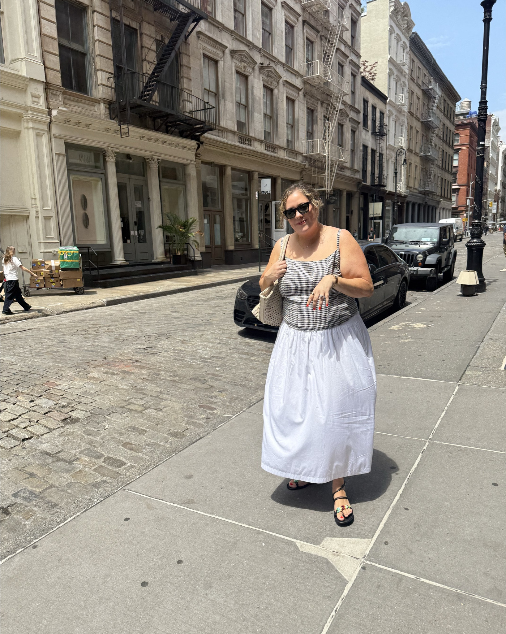 Reformation Hattie linen top in extended size in gingham is so cute. The smocked backing and darting makes it look custom tailored. I usually size up in reformation, but it was a little
But by end of the day - so I should have taken my true size.  The ES listing (pink floral) is plus. And the green is straight sizing  

Skirt and bag are Madewell. Skirt is smocked as well and I think it could easily run a size big - so even though it only goes to XXL, this could fit 22/24. 

Sandals were an Amazon find (I didn't know they were a khaite look alike) and my exact listing was taken off Amazon. However, Missy bought a pair and they're great quality, real leather. Just a smaller pony bead than mine are. 

Tote is so cute because it's a unique woven tote that's not square, and more rectangle, making it more like the popular east west style   

Bra is Missy's recommendation. Finally am able to fit into it. And it really is such a dream.  Lifting. Supportive and helps with underarm shaping. I am wearing my true size, but Missy said she usually sizes up in  bands strapless bras  ( she has much bigger chest than I do)  

#LTKSummerEdit #LTKPlusSize #LTKMidsize