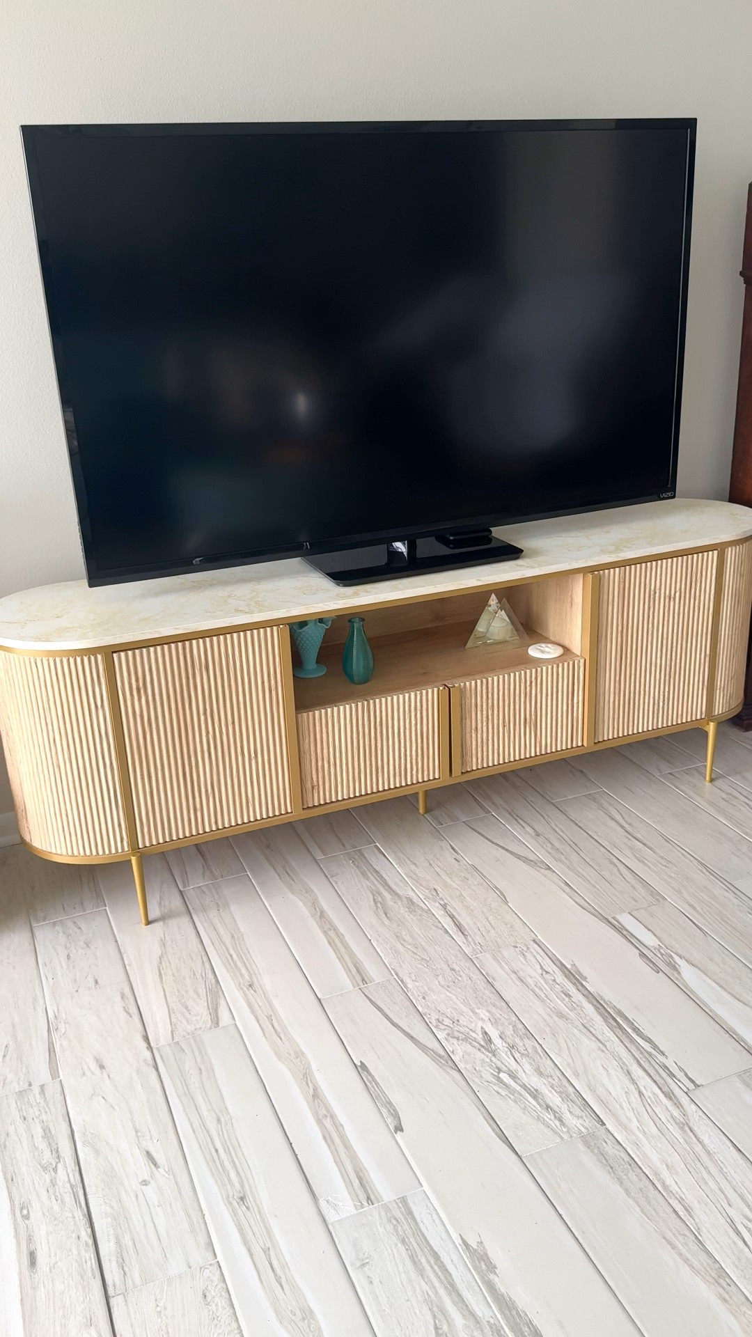 Absolutely love this new 70”entertainment cabinet/credenza. The fluted style, easy close doors & gold trim, white marble top makes it work with mid century & modern decor. Larger size = more storage! Currently on sale! Great addition to any home! 

#LTKSaleAlert #LTKHome