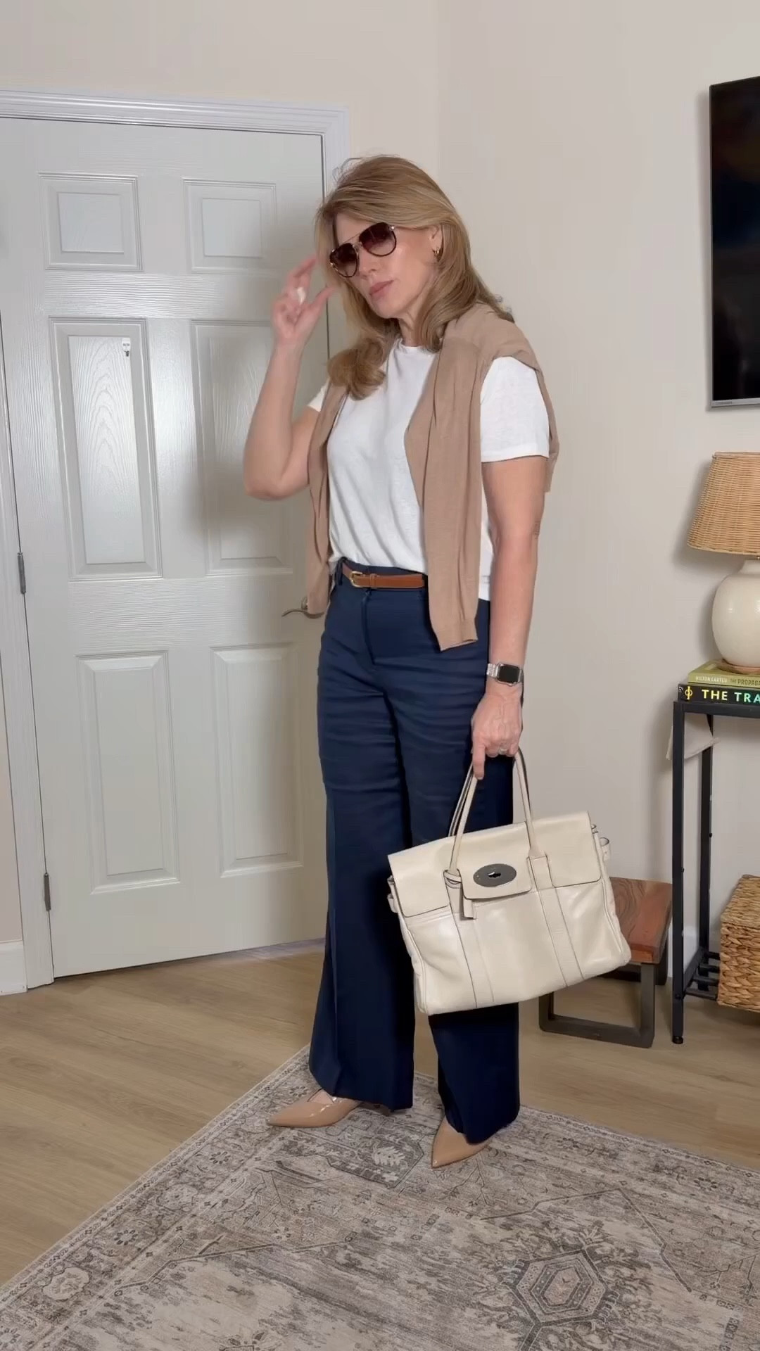 Minimal, polished, and quietly powerful 🤍

This is my go-to formula when I want to look instantly put-together without overthinking it:

• Classic white tee (clean + effortless base)
• Tailored navy trousers (elongating and chic)
• Lightweight knit draped over shoulders (adds that old money finish)
• Neutral pumps + structured cream bag (timeless, elevated)

It’s giving “I didn’t try… but I always look like this.”

This outfit works for:
✔️ work
✔️ meetings
✔️ lunch / errands
✔️ travel days when you still want to feel elevated

The secret is in the structure + neutrals — everything is simple, but intentional.

Save this as your “polished in 5 minutes” uniform.

#ltkworkwear #quietluxury #minimalstyle #effortlesschic #classicstyle


#LTKMidsize #LTKTall #LTKOver40