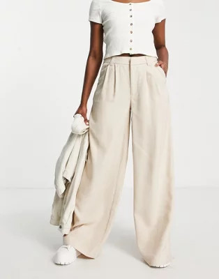 Stradivarius super wide leg tailored pants in stone | ASOS (Global)
