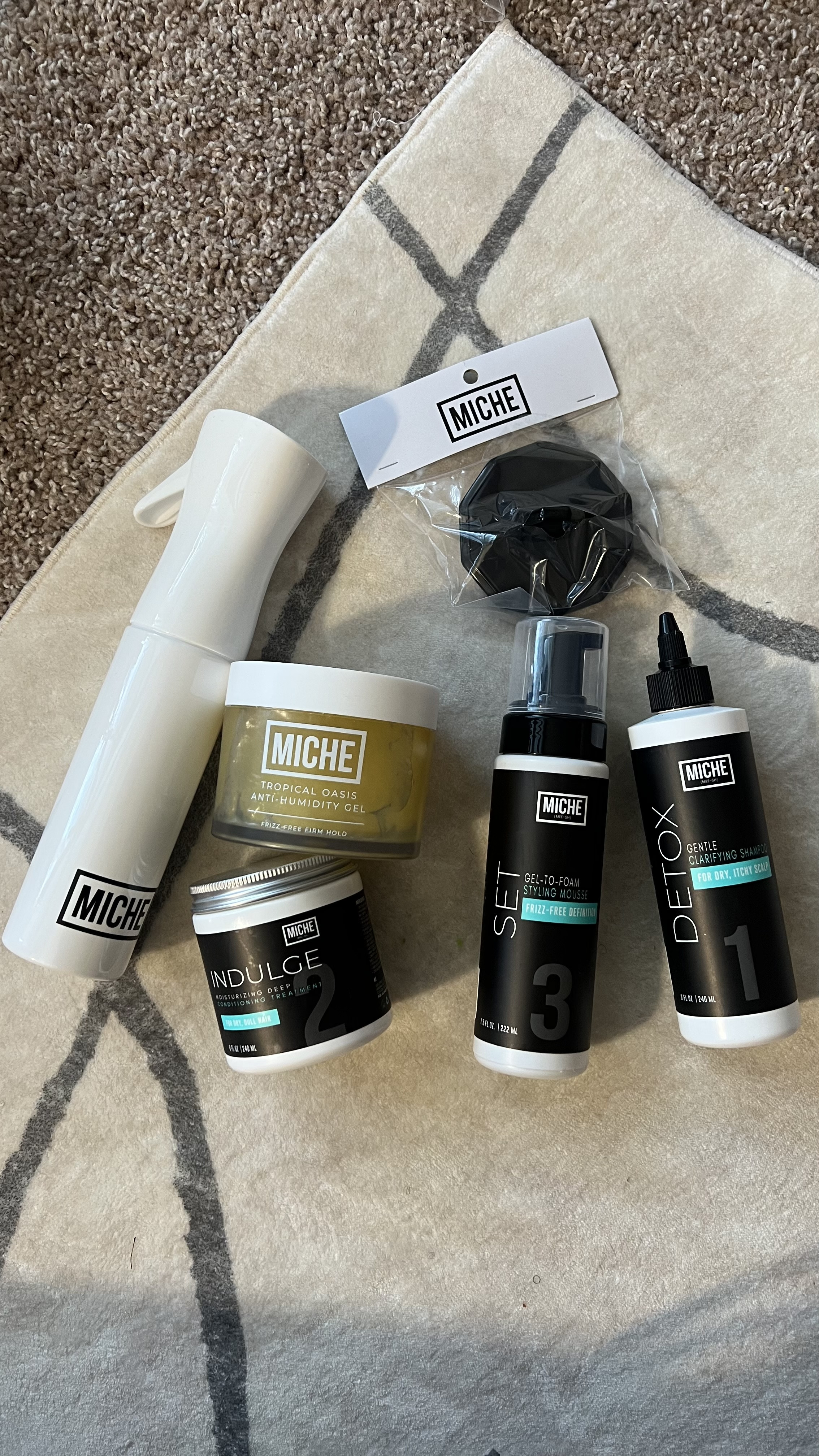 Unboxing my latest hair care faves from @michebeauty ✨

If you’ve got curly hair—from type 3A to 4C—these are products you need in your routine. I’ve used all of these before and they are seriously some of my holy grail natural hair staples!

💛 Indulge Moisturizing Deep Conditioner – Ultra rich, leaves my hair feeling buttery soft and hydrated.
🌴 Tropical Oasis Anti-Humidity Gel – Great for frizz control and long-lasting definition, especially in humid climates.
🧴 Set Gel-to-Foam Styling Mousse – My absolute favorite! Perfect for twist-outs, braid-outs, and wash-and-go styles.
💧 Detox Clarifying Shampoo – Gently removes buildup without stripping moisture—perfect for a fresh start.
💦 Continuous Mist Spray Bottle – A must-have for refreshing curls mid-week.
🧼 Scalp Shampoo Brush – Makes wash day feel like a spa day while helping to cleanse the scalp thoroughly.

If you’ve been searching for products that actually work for natural hair—especially for high-density, kinky, or coily textures—Miche Beauty has you covered. Everything is clean, hydrating, and packed with slip.

Linked everything for y’all on LTK! 💛 #MicheBeauty #CurlyHairRoutine #NaturalHairCare #WashDayEssentials #4CHairProducts #4BHair #HolyGrailHairProducts #BlackOwnedBeauty #HairProductFavorites #CurlyGirlApproved #Gifted

#LTKBeauty #LTKFindsUnder50