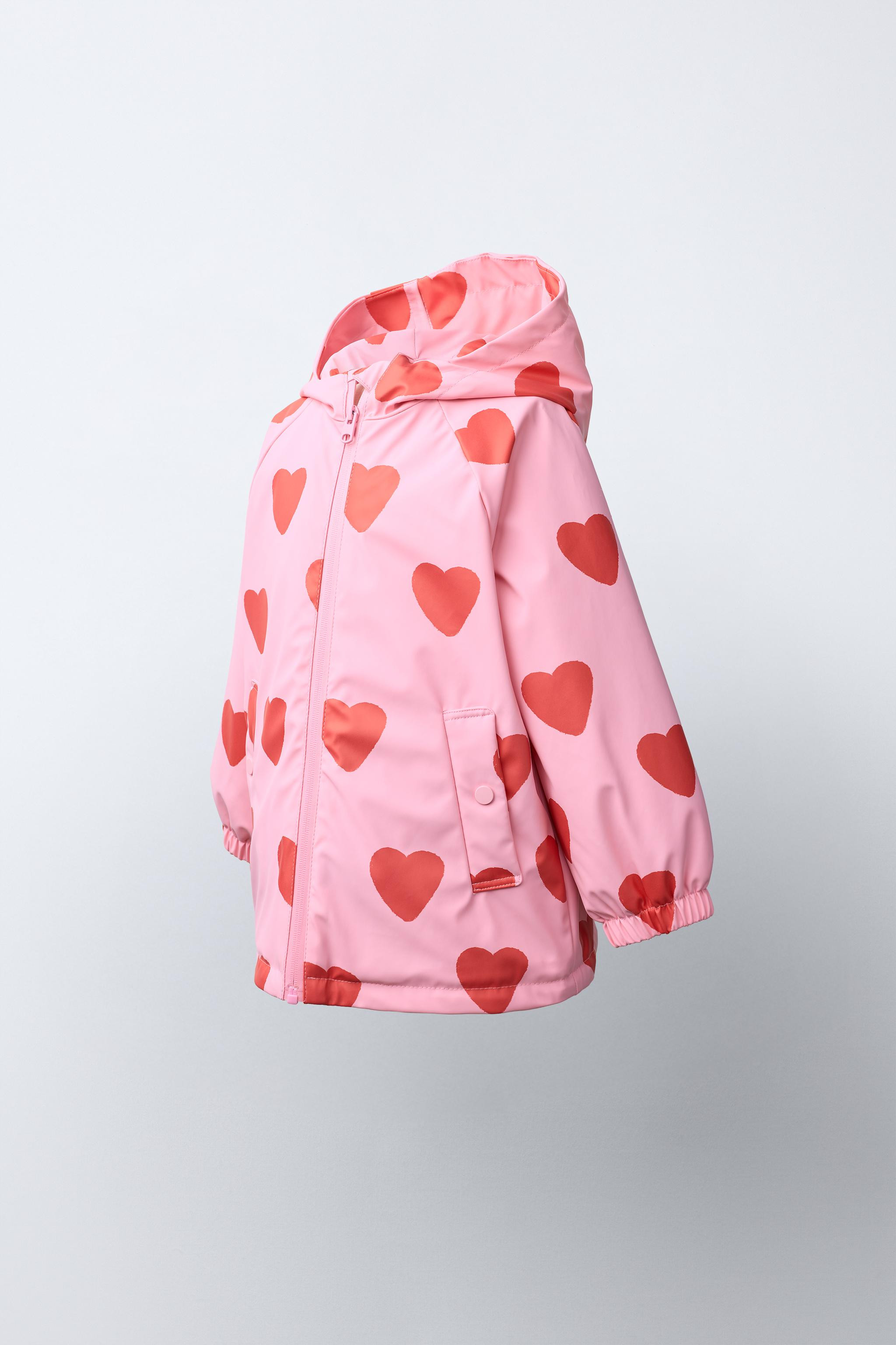 Raincoat in a special water-resistant fabric. Features a hoodie, high collar, and long sleeves wi... | Zara US