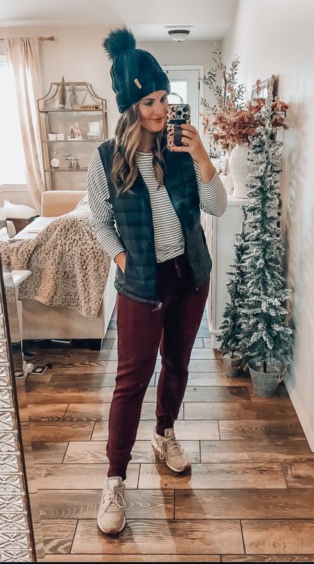 Casual winter outfit from Amazon! The comfiest striped long sleeve tee, puffer vest and fleece lined leggings! Paired with my leopard neutral new balance sneakers & winter hat! 

#LTKFind #LTKunder50 #LTKsalealert