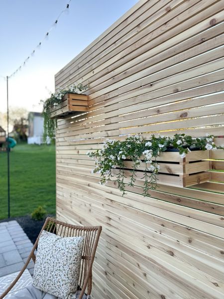 Our DIY wooden slat privacy wall with built-in flower boxes is complete for spring & summer outdoor lounging!  



#LTKhome #LTKfamily #LTKSeasonal
