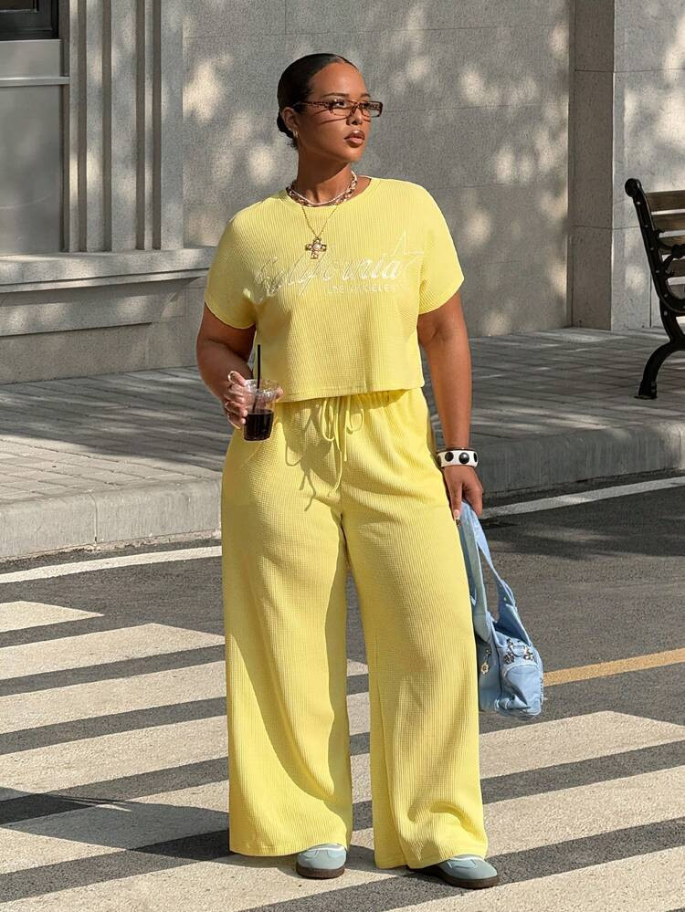 SHEIN Muchic 2026SSpring And SummerWomen's Plus Size Round Neck Letter Embroidery Graphic Short Sleeve Top And Drawstring Waist Wide Leg Pants Casual 2 Piece SetOutdoor Clothing, Back To School, Street Clothing, Y2K Clothing, Beach Vacation Clothing, Summer Outfits | SHEIN