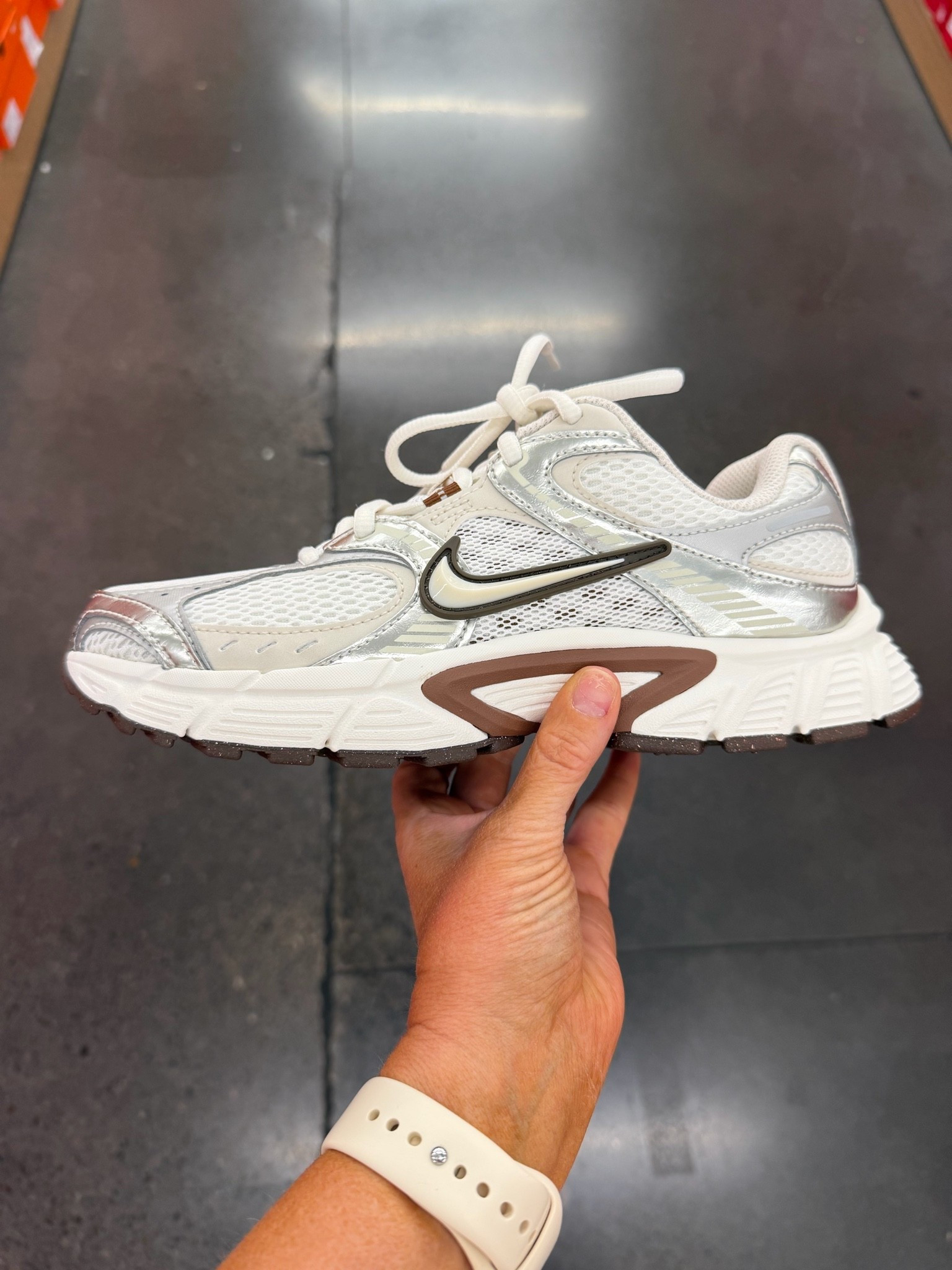 Love the chocolate brown details on these running shoes.