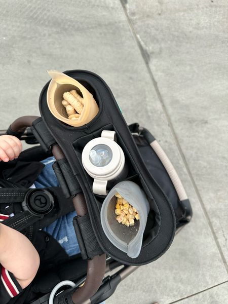 Stroller caddy for snacks. Love this attachment for our stroller for snacks and his cup 

#LTKbaby #LTKunder50 #LTKkids