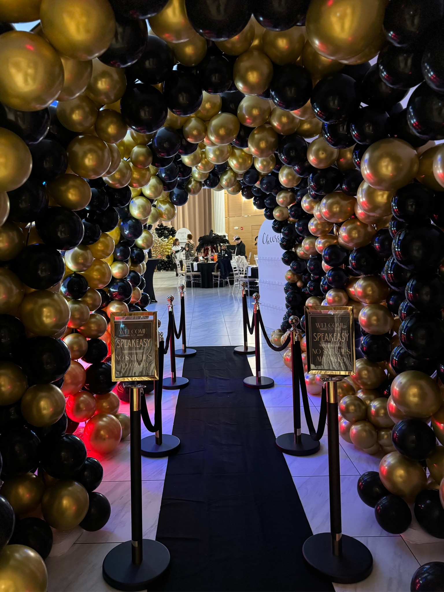 Great Gatsby/ Roaring 20s themed party balloon tunnel entrance 
Used 6 arch stands and 10 balloon kits (5 gold and 5 black) for the tunnel 
2 packs of the gold stanchion poles + an additional pack of black ropes

#LTKparties