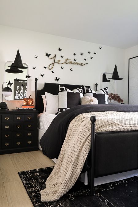Linking similar black upholstered beds as this one is sold out. The Halloween decor, mirrors, and black lamps are amazon finds!! #meandmrjones #amazonhomedecor 

#LTKunder50 #LTKHalloween #LTKhome