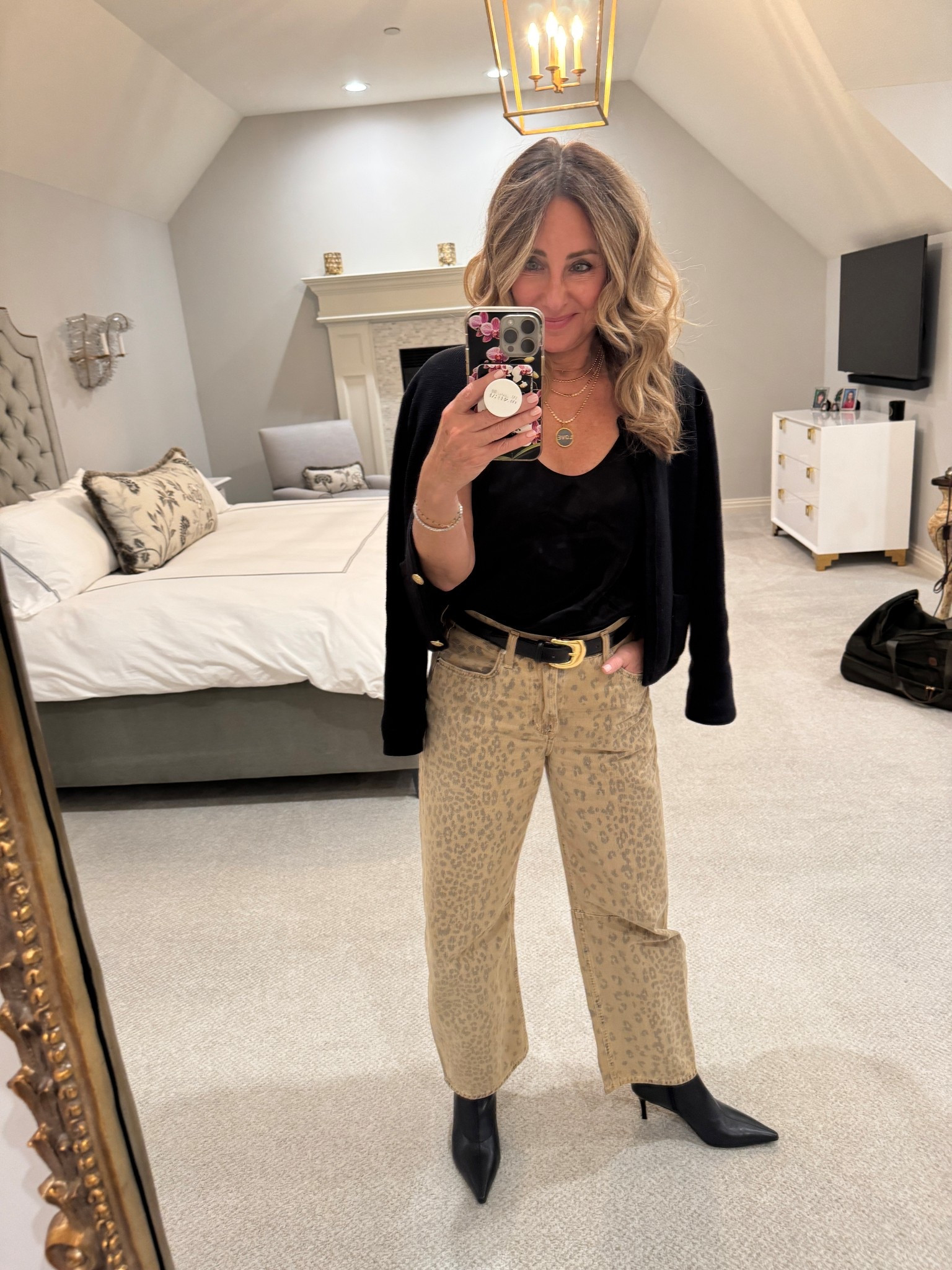 We had dinner out with friends. I always love the simple formula of wearing a camisole and a sweater with jeans for dinner. It seems to walk that perfect line between not too dressy and not too casual. I would say a simple black silk camisole is a staple in my wardrobe. I do love this one in particular. And I also paired these jeans with a T-shirt and sweater as a Thanksgiving option. You can see it in one of the recent reels in my feed.

#LTKHoliday #LTKdayinmylife #LTKPetite