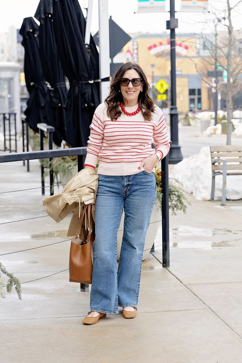 A striped sweater is always a good idea ❤️ Paired with relaxed wide-leg jeans and neutral flats for an easy, polished everyday look. The pop of red makes it feel fresh for spring. 

 #LTKSeasonal #LTKOver40