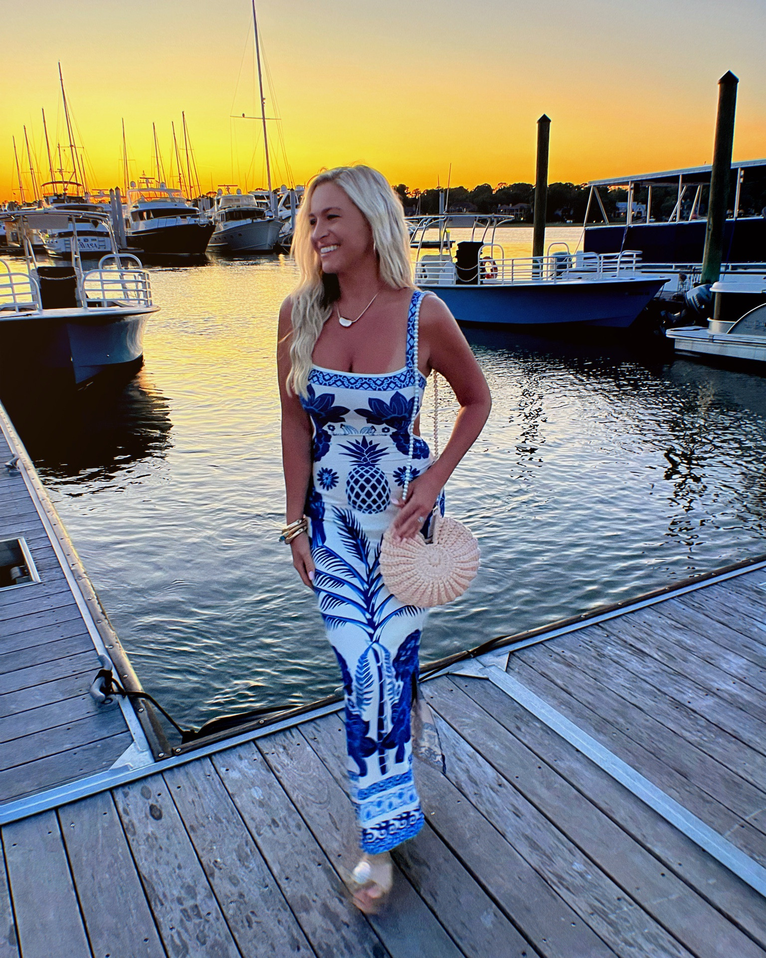 Golden hour at the marina, salty air, and a dress that turns heads 💙🌅⚓️ The tropical blue print, soft feel, flattering fit, and cutest shell purse make this one of my favorite vacation-ready looks. Just add waterfront views and you’re set!

#LTKootd #LTKSwim #LTKTravel