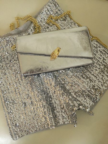 A mini short with the most, covered in small, silver sequins and made from smooth, stretchy yarn.

Pairs perfectly with a metallic crossbody. The silver crinkled metallic leather juxtaposes nicely with the hand motif.

#LTKSeasonal #LTKitbag #LTKstyletip