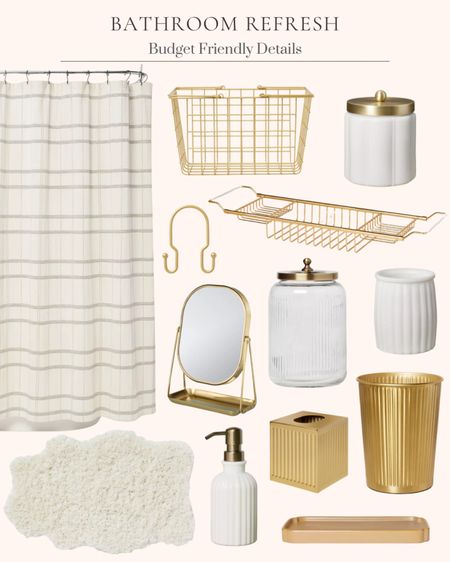 Bathroom refresh ideas and inspiration. Budget friendly finds. Shower curtain. Gold metal basket. Gold metal double shower curtain hooks. Brass vanity flip mirror. Large glass bathroom canister. Ceramic bathroom tray. Milk glass bathroom tumbler. Milk glass soap pump bottle. Milk glass canister. Brass bathroom tissue holder. Brass bathroom garbage can. Extendable wire bathtub caddy. White plush shaped bath rug  

#LTKstyletip #LTKfindsunder50 #LTKhome