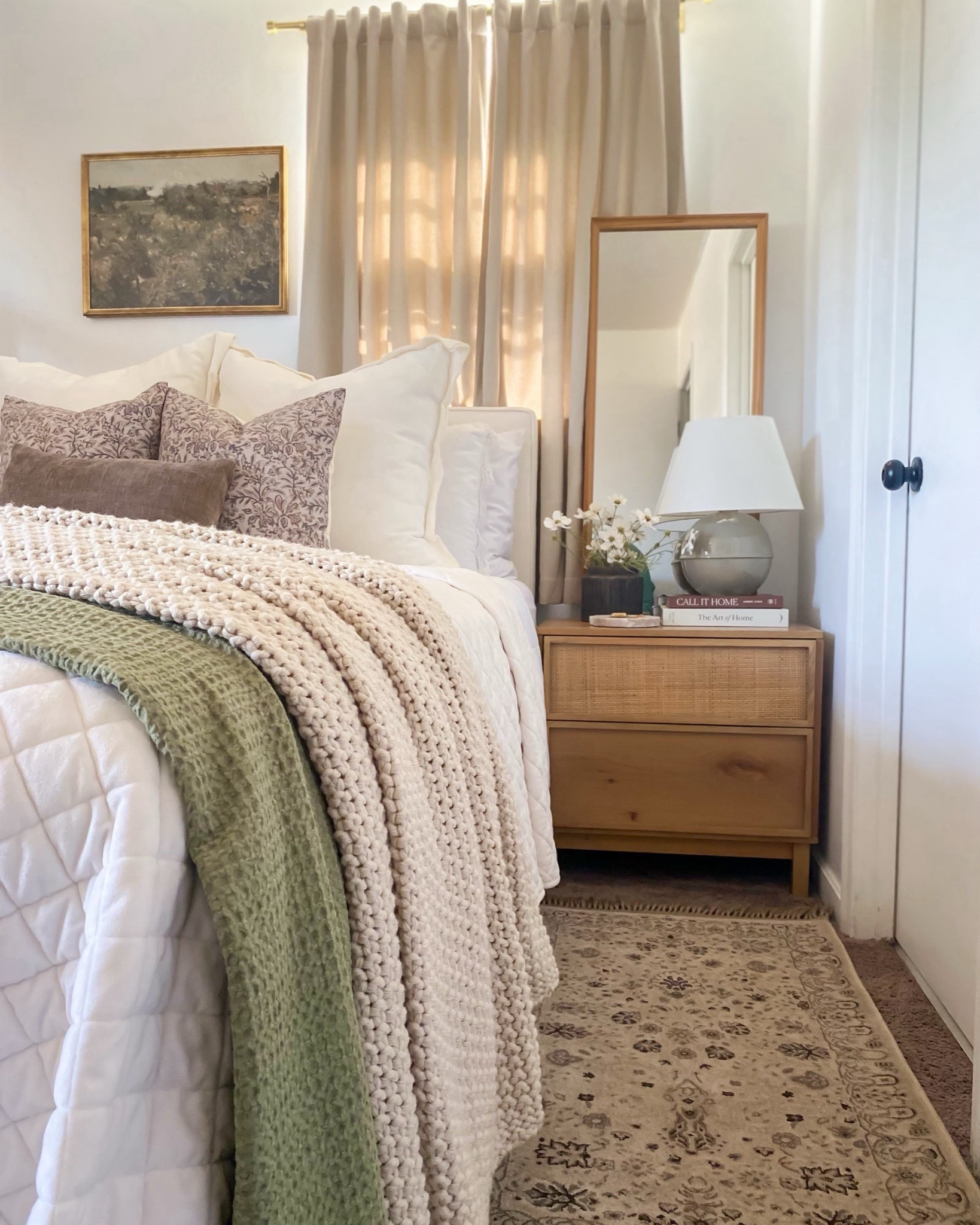Spring / Summer bedroom styling idea
Summer bedroom inspo, casaluna throw blanket, floral pillow, green throw blanket, green lamp, natural wood nightstand, mirror behind nightstand, nightstand styling idea, landscape art, art above bed, bedding laying idea 



#LTKSeasonal #LTKSaleAlert #LTKHome