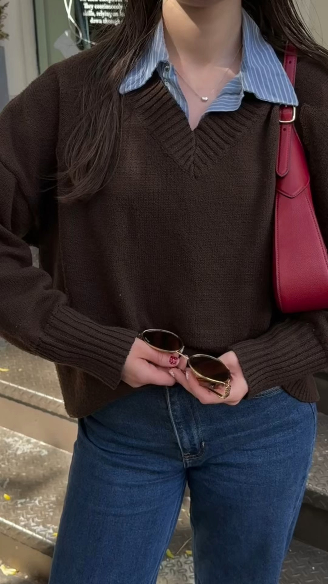 
transitional fall outfit inspo, fall fashion, fall outfit, fall outfits, fall 2025, fall dress, fall fashion, inspo, outfit ideas, outfit fall, preppy outfits, brown v neck sweater, east coast fall outfit, coastal granddaughter outfit, coastal grandmother outfit, dark wash jeans outfit, blue striped shirt outfit, oval sunglasses, miu miu sunglasses,