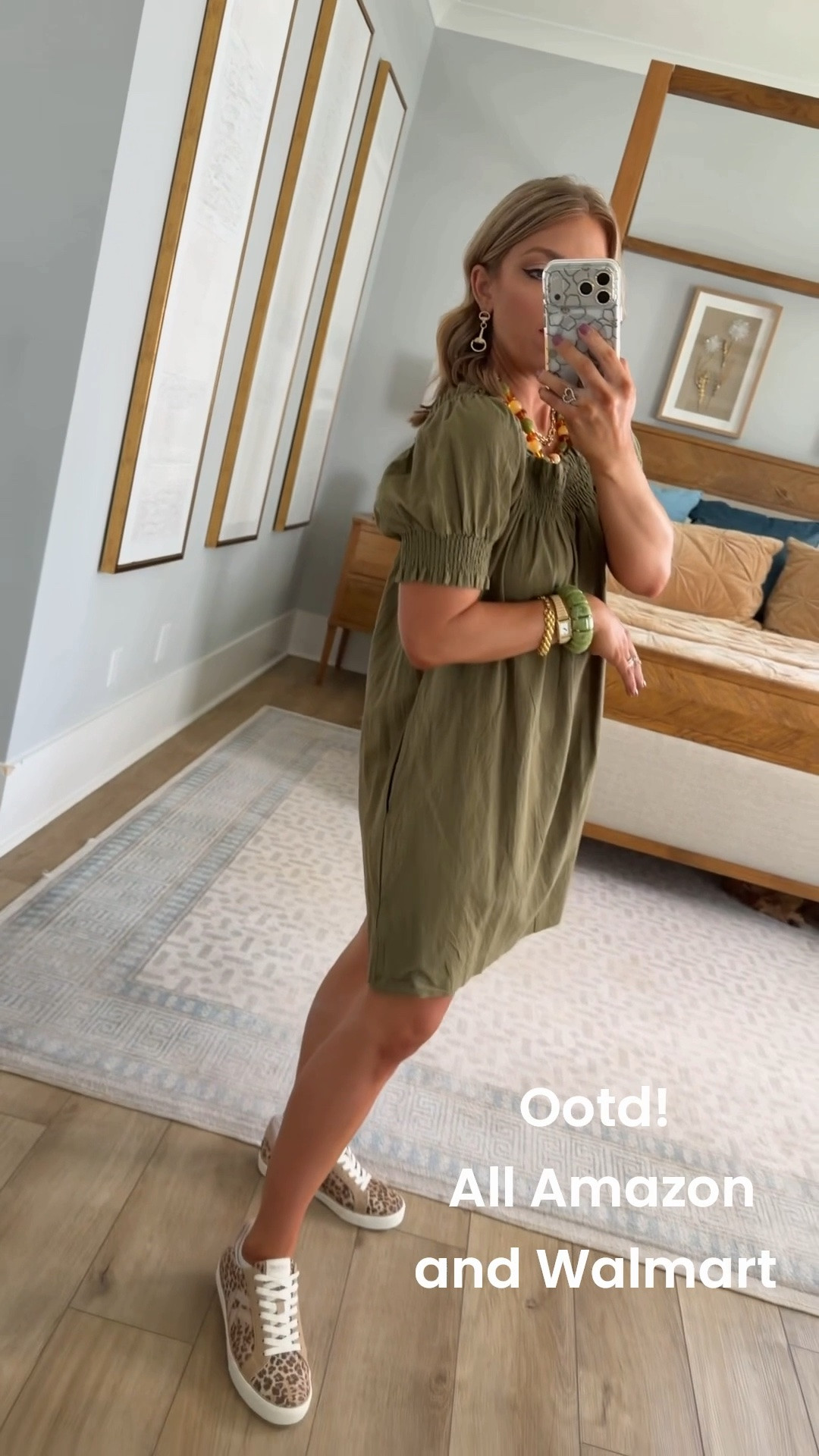 Today’s OOTD is the cutest Amazon fashion find! 🤎🍂 This olive green mini dress is such a good summer-to-fall transition piece—the color is perfect for wearing now with sneakers and later with boots, booties or a denim jacket. I love the smocked neckline and puff sleeve details too!

Paired it with my Amazon leopard sneakers that are ON SALE right now! 🙌🏼 The leopard print with this olive green is such a cute combo. Most of my jewelry is Walmart, including the prettiest green statement bracelet and gold pieces, and my chunky beaded necklace is another Amazon find. Such an easy, affordable outfit that still feels so put together!

#AmazonFashion #AmazonFinds #AmazonFashionFinds #AmazonDress #AmazonStyle #AmazonOutfit #WalmartJewelry #WalmartFinds #OOTD #OutfitOfTheDay #SummerToFall #SummerToFallStyle #TransitionOutfit #AffordableFashion #AffordableStyle #LeopardSneakers #CasualOutfit #MomStyle

#LTKootd #LTKPetite