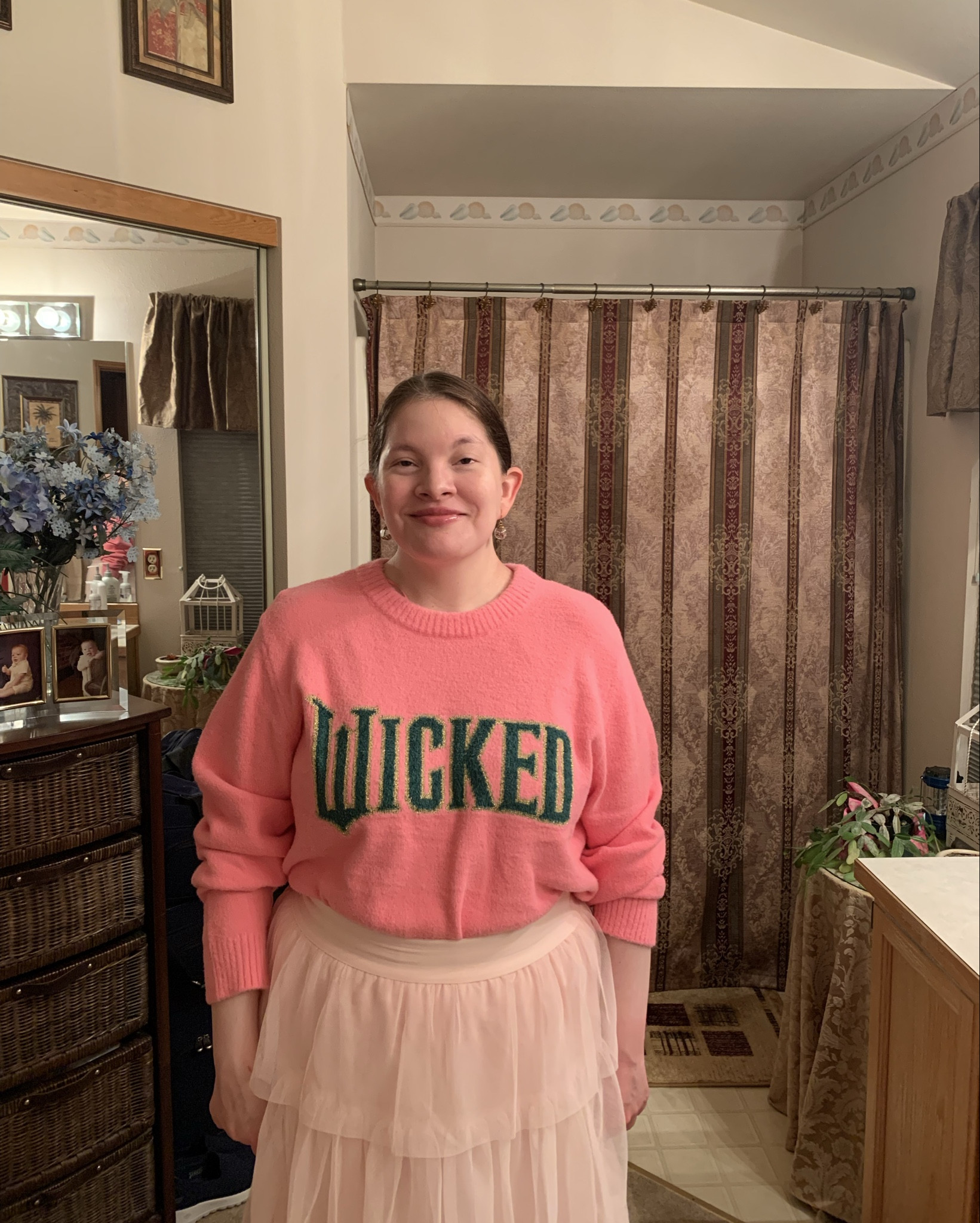 Something Wicked Is Coming! I just watched Wicked For Good With my friend! I love it so much! I wore an outfit inspired by Galinda or Glinda! My glass ball earrings look like bubbles 🫧 with glitter in them. I wore my Pink Wicked Sweater From Target. My Pink TuTu skirt is from On 34th at Macy’s. I even work my Black INC Fawn Leather Riding Boots and my Black Jou Jou Leather Jacket too. Who is watching Wicked For Good This Weekend? #WickedForGood #Wicked 

#LTKootd #LTKdayinmylife #LTKHoliday