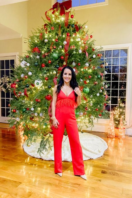 Red jumpsuit with feathers 

#LTKHoliday #LTKstyletip #LTKwedding
