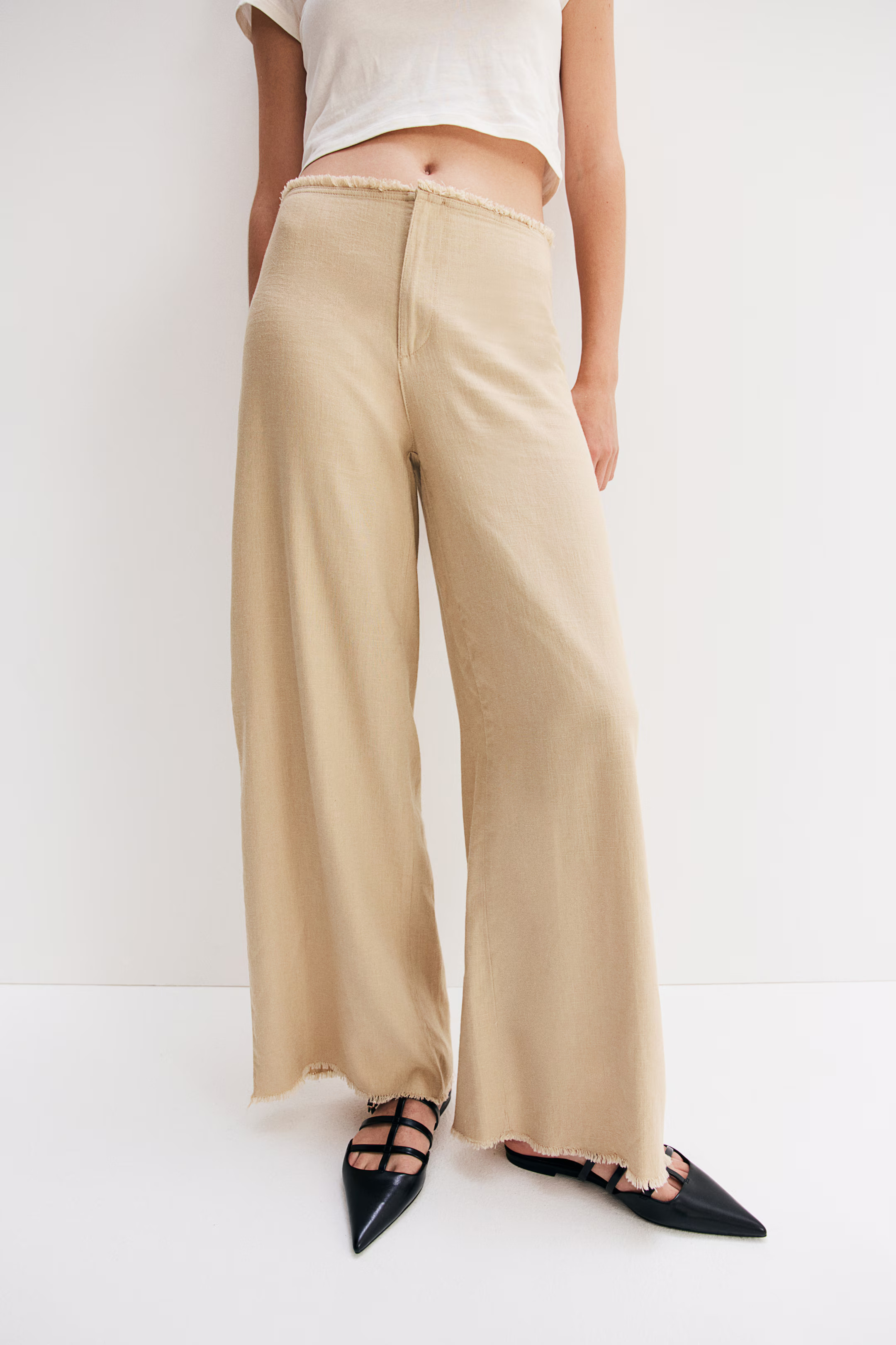 Pantaloni in misto lino con bordi sfrangiati - Vita normale - Lungo - Beige - DONNA | H&M IT | H&M (FR, IT, ES, PT, BE)