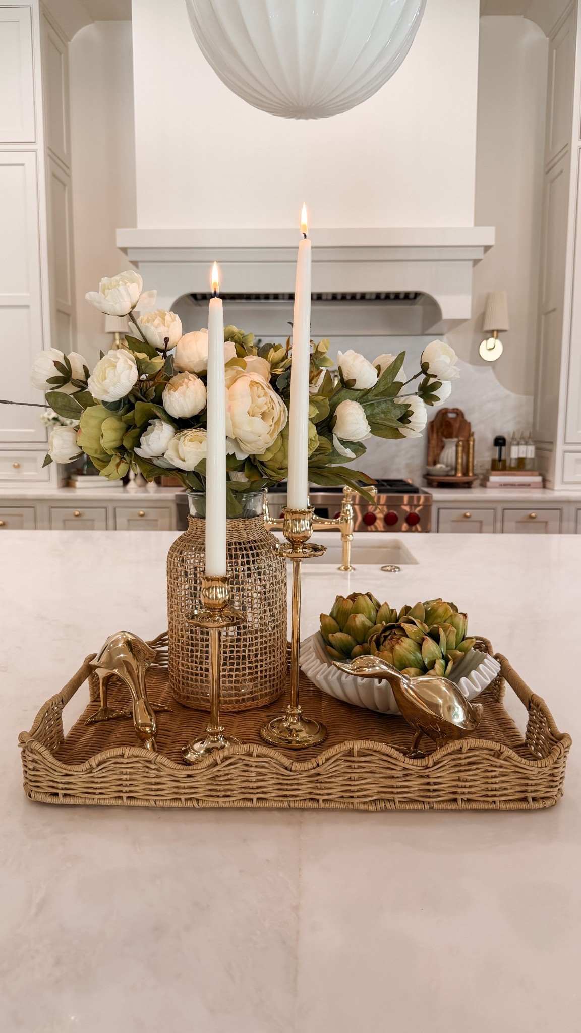 Obsessed with this kitchen centerpiece! These brass candlestick holders are an absolute must! 

#LTKHome #LTKSeasonal