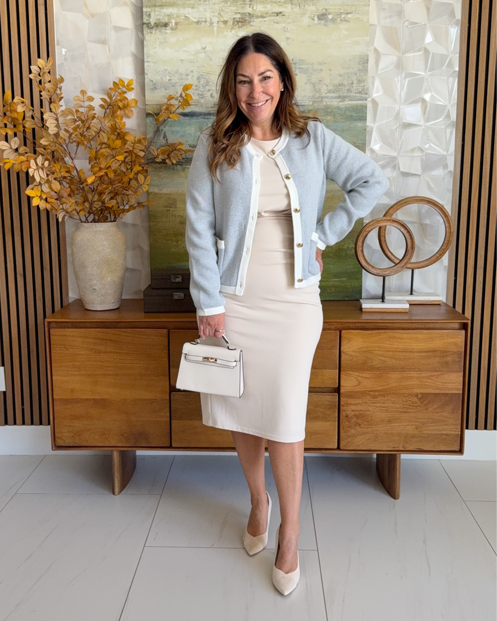 Ladylike workwear outfit 🤍 Heather gray gold-button cardigan from @quince over a cream sheath dress from Amazon styled with a white top-handle bag and nude suede pumps. A soft, feminine office look in neutral tones.

Sizing: Dress tts, L | Sweater tts, L

#LTKWorkwear #LTKOver40 #LTKMidsize