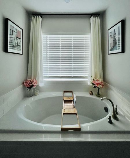 Prepping for Valentine’s Day with our most romantically decorated space. The pink flowers, European street prints, pine curtains, and bath tray over the tub really give V-day vibes. 

Linked several options of similar faux pink flowers, linen curtains that are both straight and pinch pleated, and the other details in this space. 

#LTKhome #LTKSeasonal #LTKfindsunder50