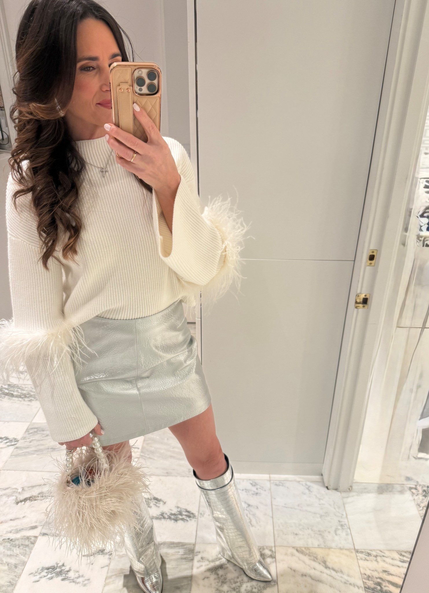Holiday party look last night 
Ivory and silver 🤍🩶

Ivory sweater with feathers
Ivory feather handbag with pearl handle 

Silver metallic skirt
Silver earrings
Silver metallic boots 
Silver cross necklace 



#LTKHoliday #LTKgrwm #LTKootd