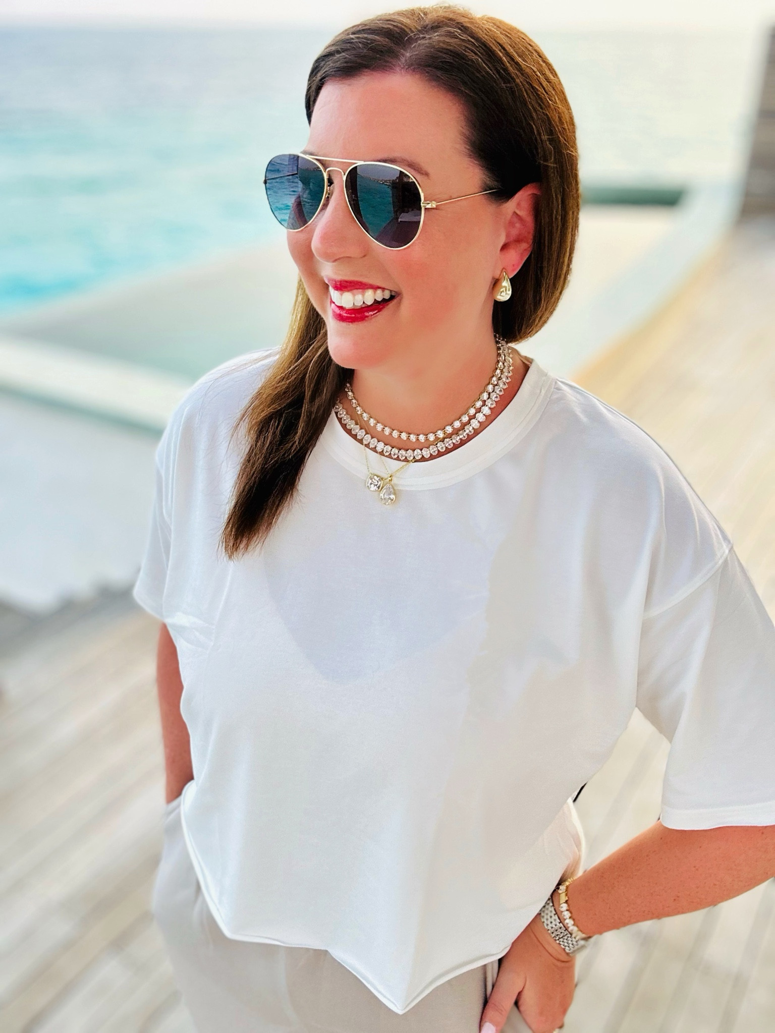 Casual resort evening look! This boxy cropped tee is a great FP movement look for less!

#LTKtravel #LTKover40 #LTKmidsize