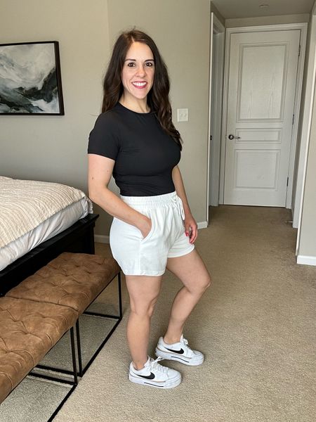Wearing a medium in top and shorts. Top runs small. I could have gone with a small in the shorts. Shoes run 1/2 big.

Casual outfit, comfy outfit, Nike gym shoes, black gym shoes, white gym shorts, black t-shirt, workout outfit, travel outfit

#LTKtravel #LTKfitness #LTKfindsunder50