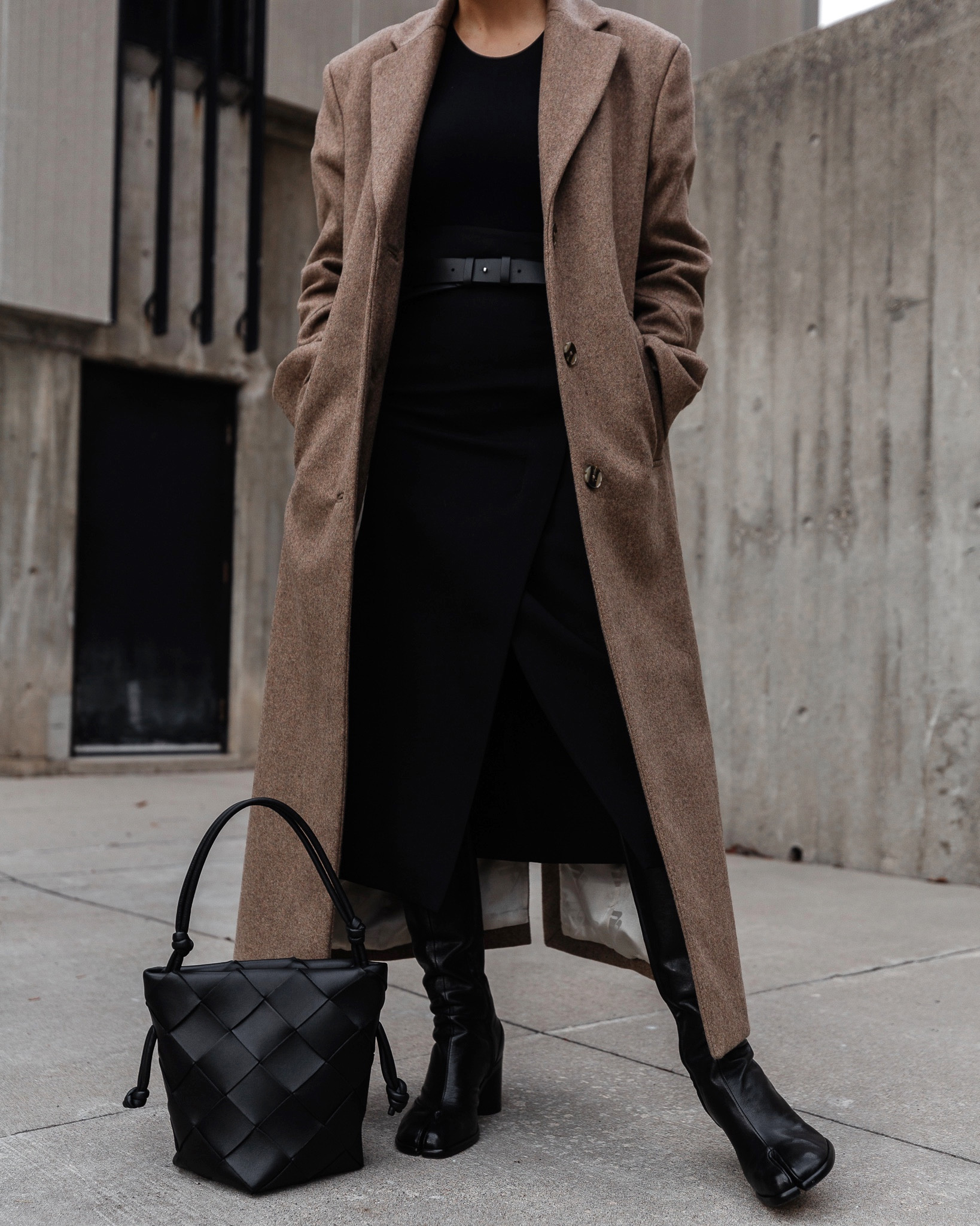 Black midi skirt. Tall Maison Margiela Tabi boots (tts). Beige coat from Remain Birger Christensen. 

#LTKstyletip #LTKFind #LTKSeasonal