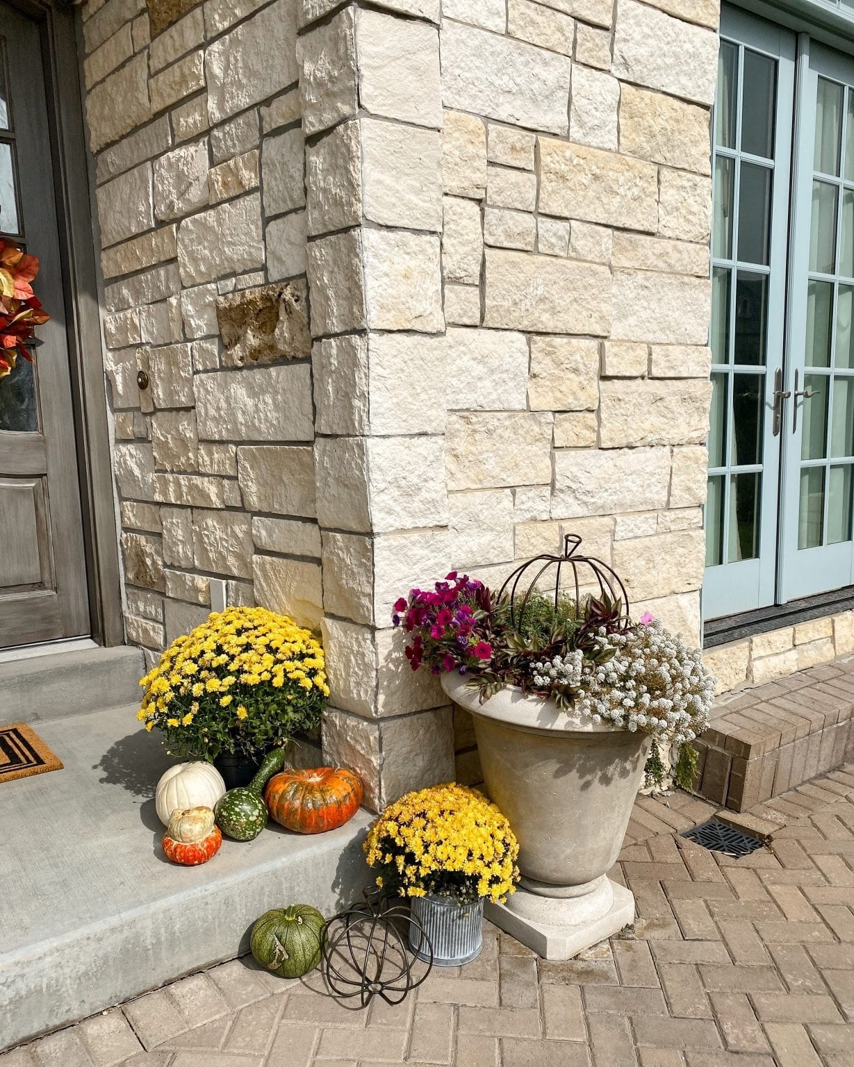 I added mums in containers and pumpkins and gourds on the upper part of the front porch! Sharing similar sources to recreate the look. 

#LTKHalloween #LTKSeasonal #LTKHoliday