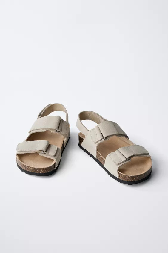 100% cowhide leather sandals with a split leather finish. Double hook-and-loop strap closure at t... | Zara US